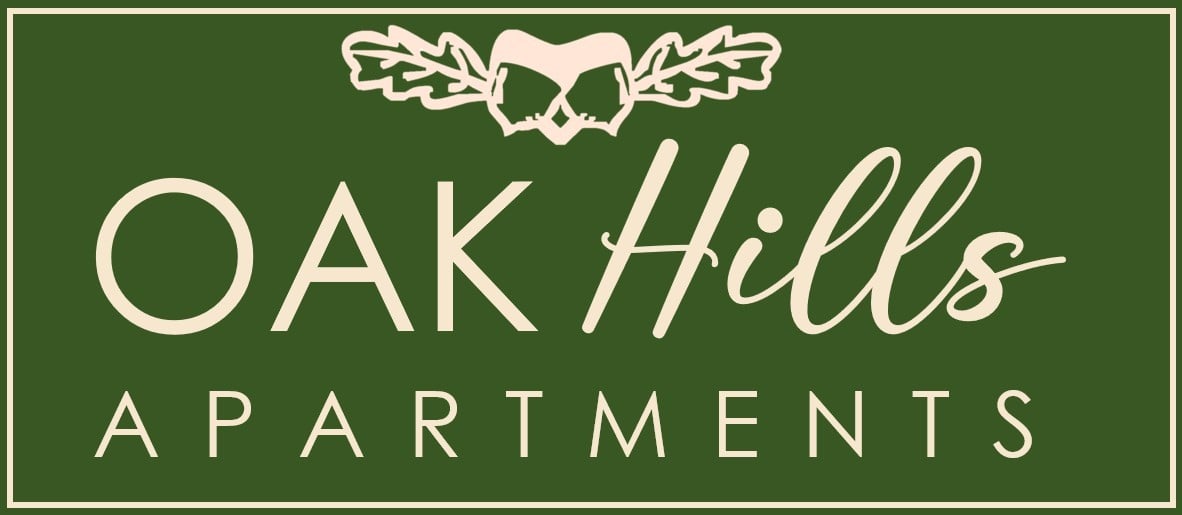 A logo for Oak Hills Apartments with a heart-shaped leaf design.